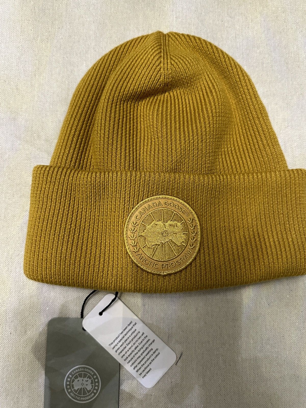 image of Canada Goose Arctic Disc Toque Merino Wool in Gold, Men's