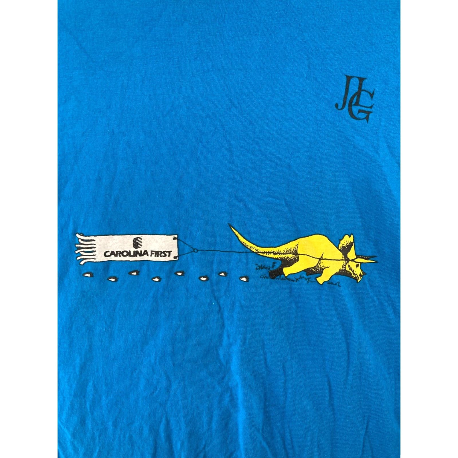 Hanes Dinamation Mens Shirt L Blue Carolina First Hanes Graphic Print 90s USA Dinosaur Crew Neck Cotton T-Shirt Size US L / EU 52-54 / 3 - 6 Thumbnail