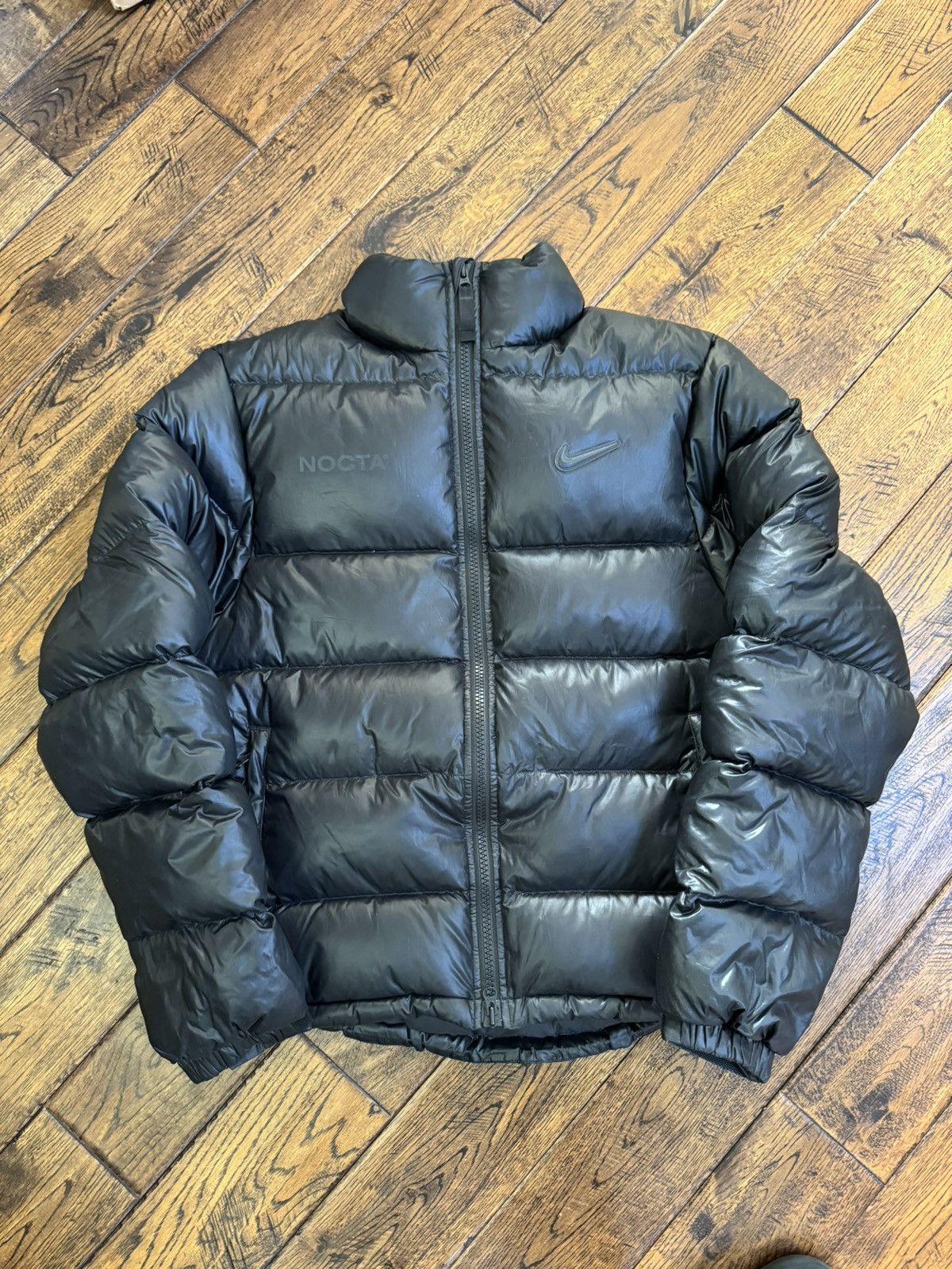 image of Drake x Nike Nocta Sunset Puffer Jacket in Black, Men's (Size Medium)