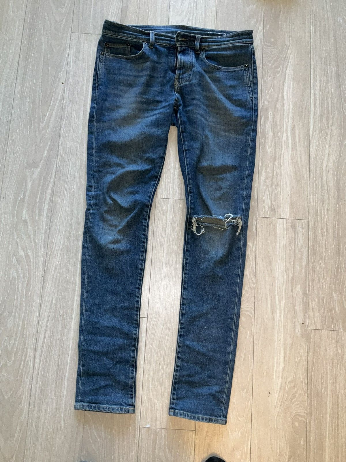 image of Saint Laurent Paris Saint Laurent Distressed Denim in Blue, Men's (Size 34)