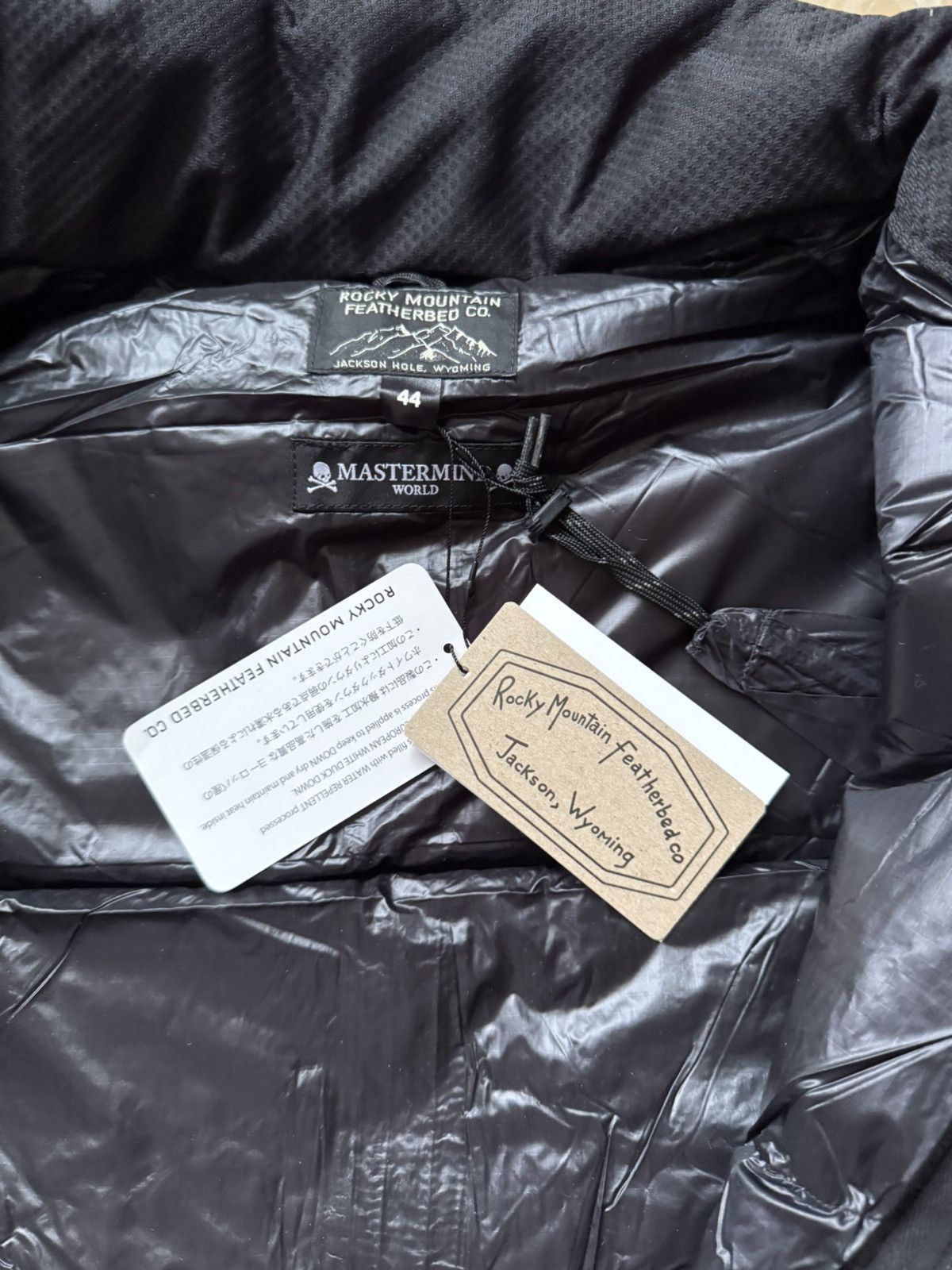 Rocky Mountain Featherbed × MASTERMIND WORLD DOWN JACKET