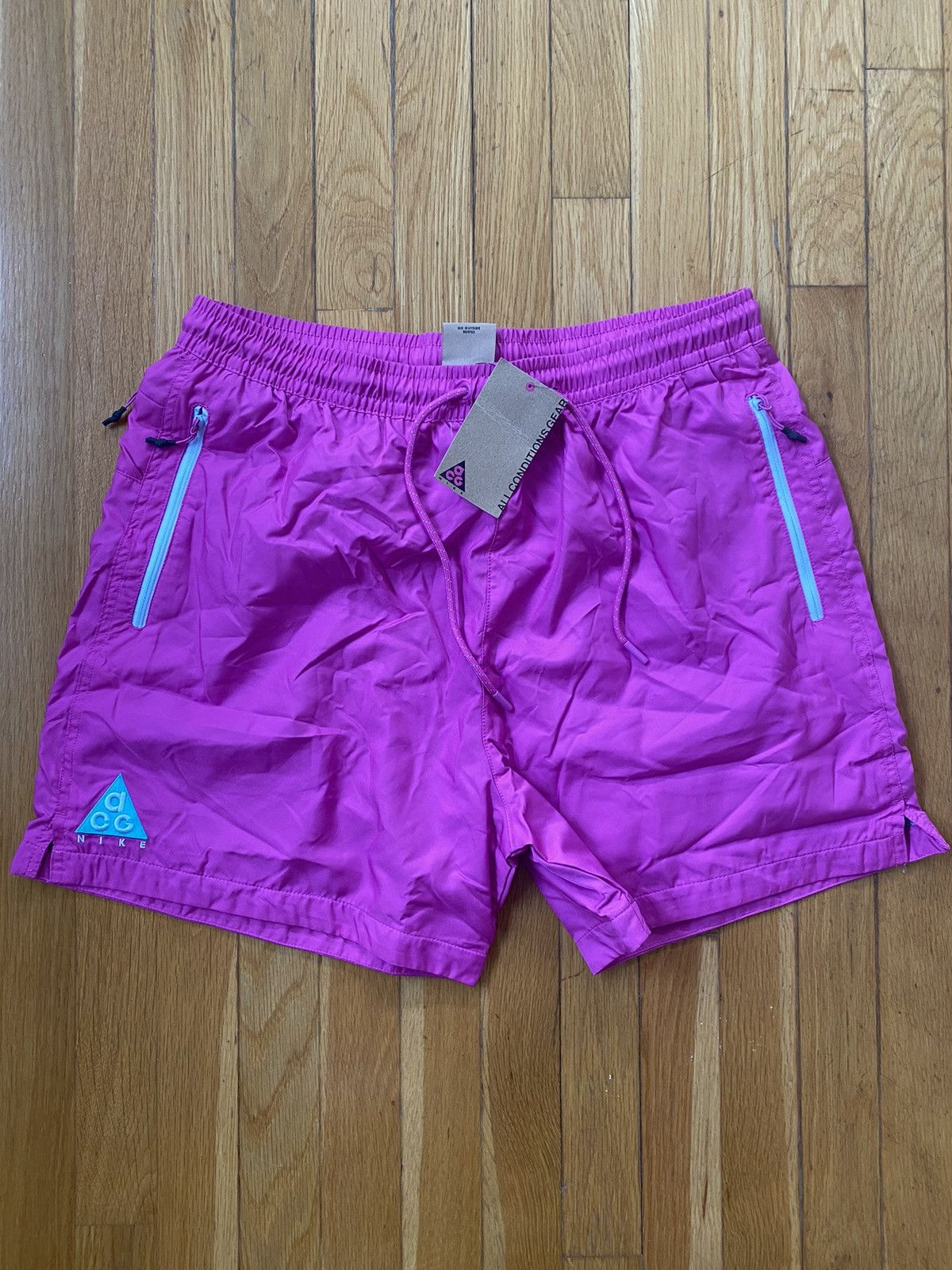 image of Nike Acg Woven Shorts in Pink, Men's (Size 34)