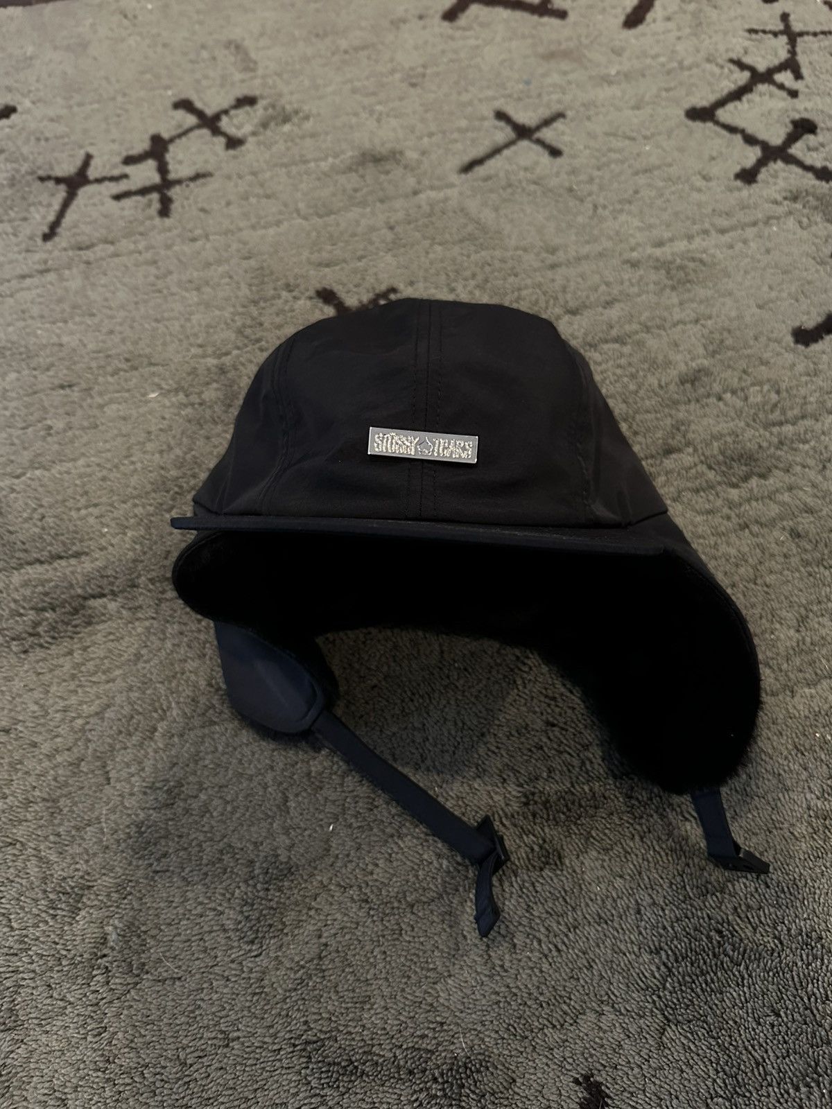 stussy × Denim Tears EARFLAP CAP Buy Stussy x Denim Tears Earflap Cap 'Black' - 331246 BLAC | GOAT