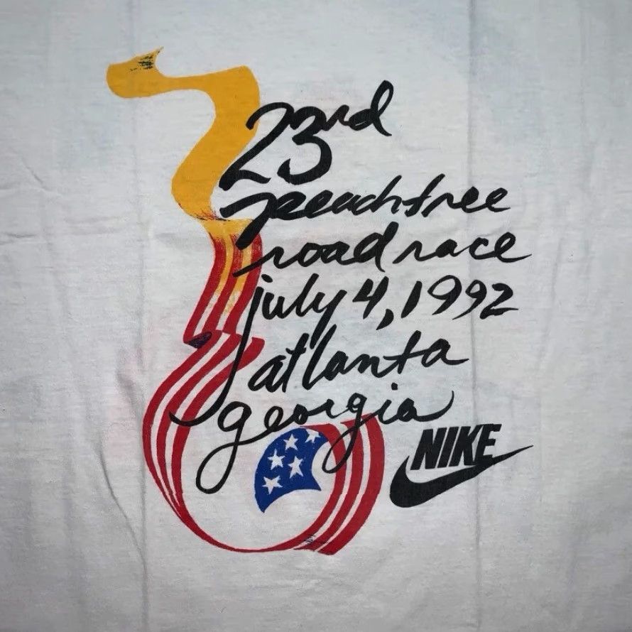 Nike VINTAGE Nike T Shirt Mens XL Peach Tree Georgia Atlanta USA 1992 July 4 80s 90s Graphic Tee White Crew Neck Short Sleeve Sportswear/Beach Mens Size US XL / EU 56 / 4 - 2 Thumbnail