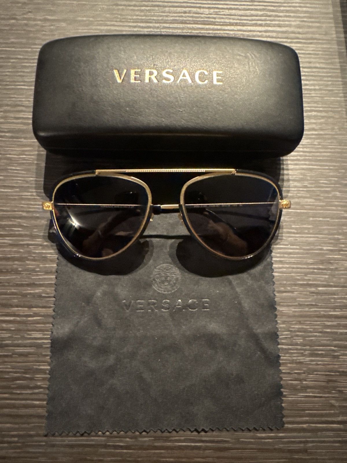 Versace Versace VE2193 142887 56 Tribute Gold/Black Sunglasses Size ONE SIZE - 1 Thumbnail