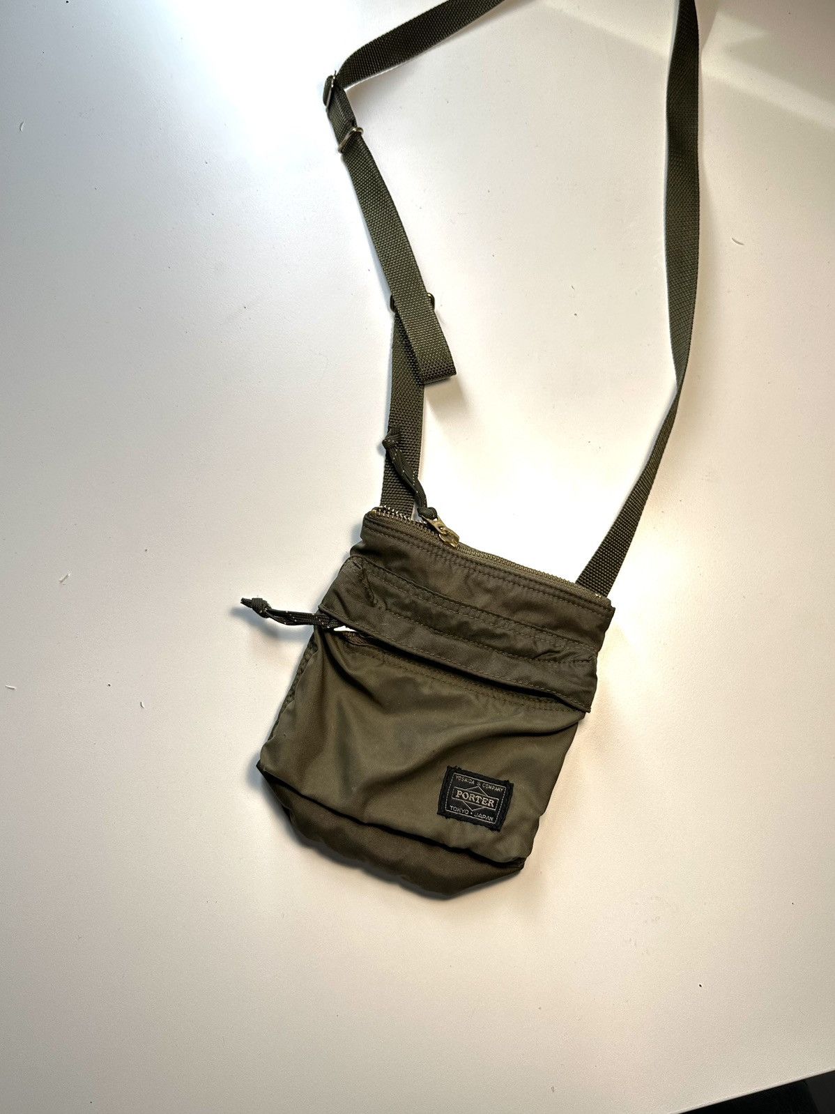 image of Porter x Porter Yoshida Co Sling Bag in Green, Men's