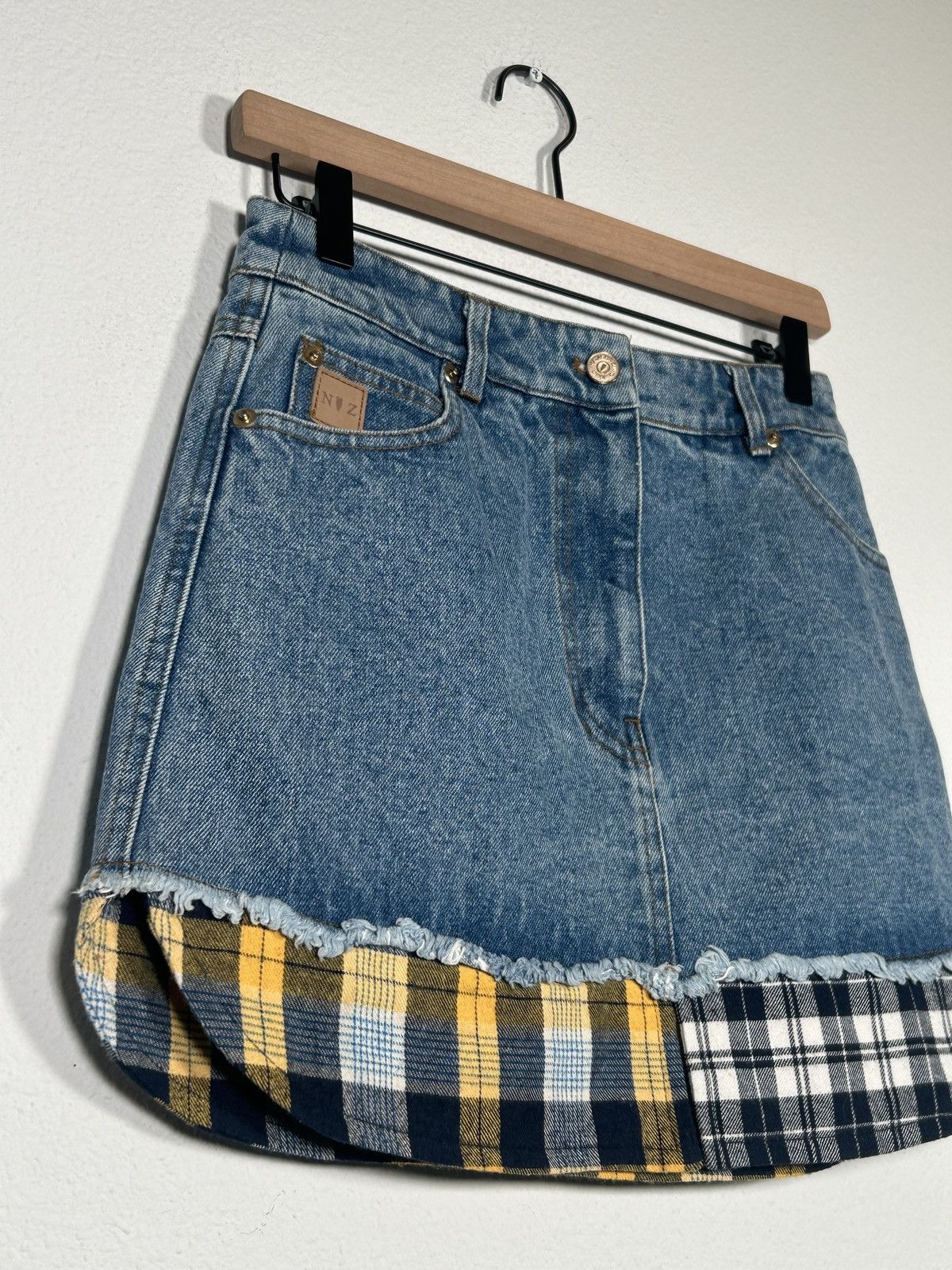 Distressed hybrid denim flannel mini skirt
