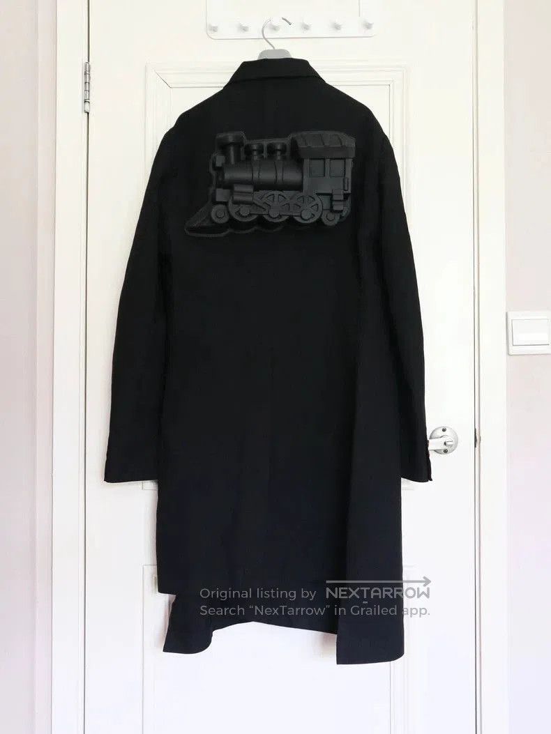Comme des Garcons Homme Plus Black Coat.