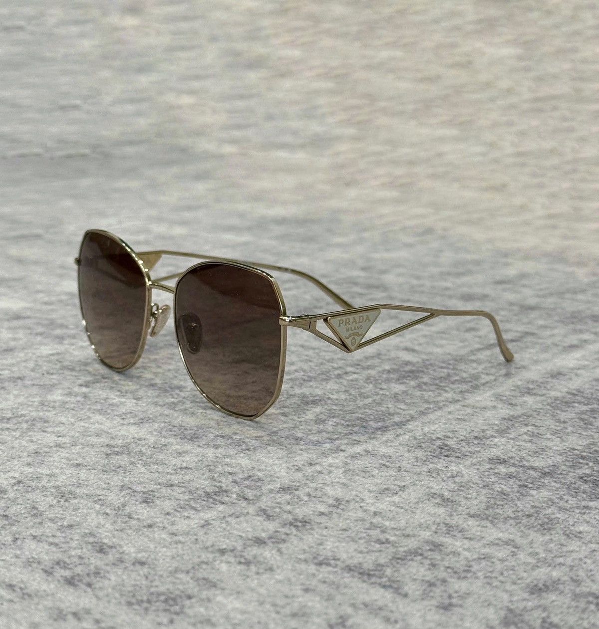 Prada Prada 57YS ZVN3D0 Pale Gold Brown Size ONE SIZE - 1 Thumbnail