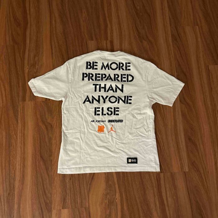 Jordan Brand × Undefeated Air Jordan x UNDEFEATED Strikes T-Shirt 'White' DX4304 100 Size US M / EU 48-50 / 2 - 4 Thumbnail