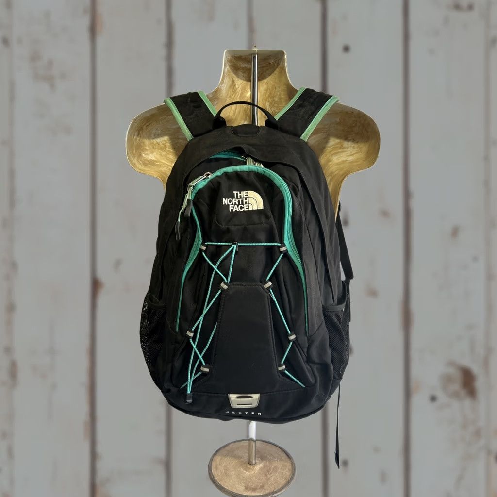 black and mint green north face backpacks The Women's Borealis Backpack while the reflective details enhance visibility in low light conditions The North Face The North