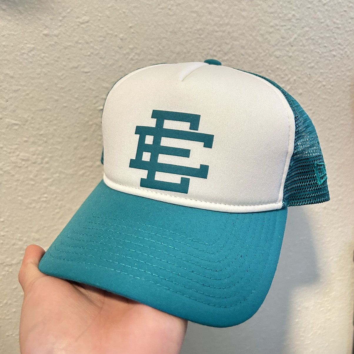 image of 2021 Eric Emanuel New Era Trucker Hat in Teal, Men's