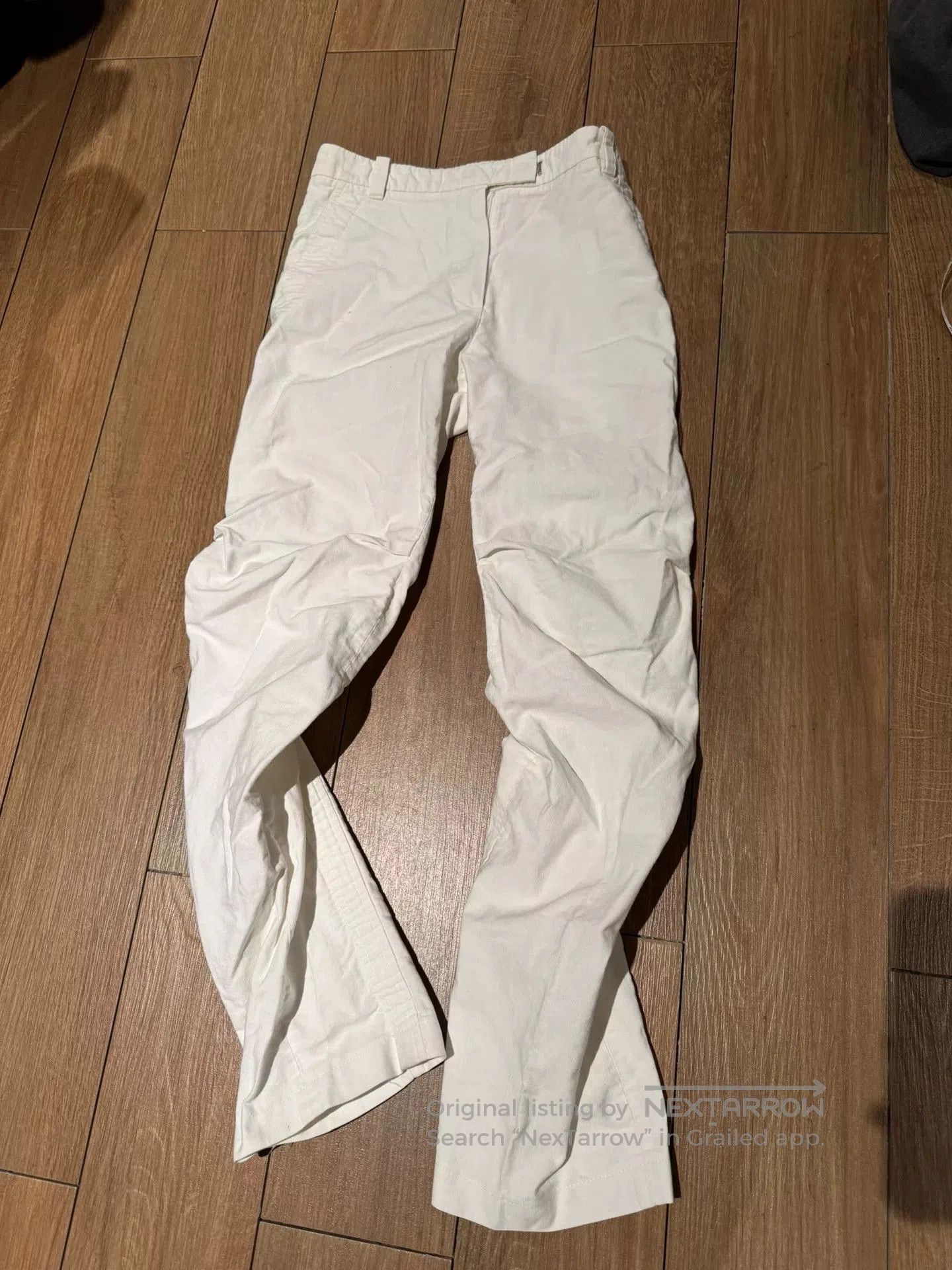 unique white pleated denim trousers.