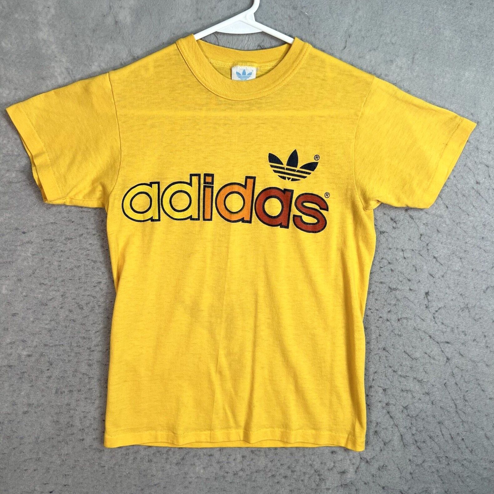 image of Vintage 70's Adidas Spellout Logo T Shirt Adult Small Yellow Mens in White