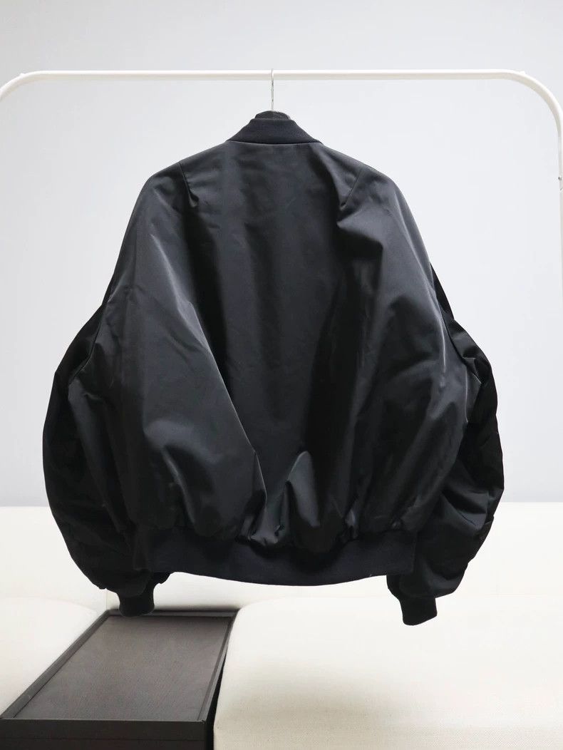 lad musician oversized black bomber jacket