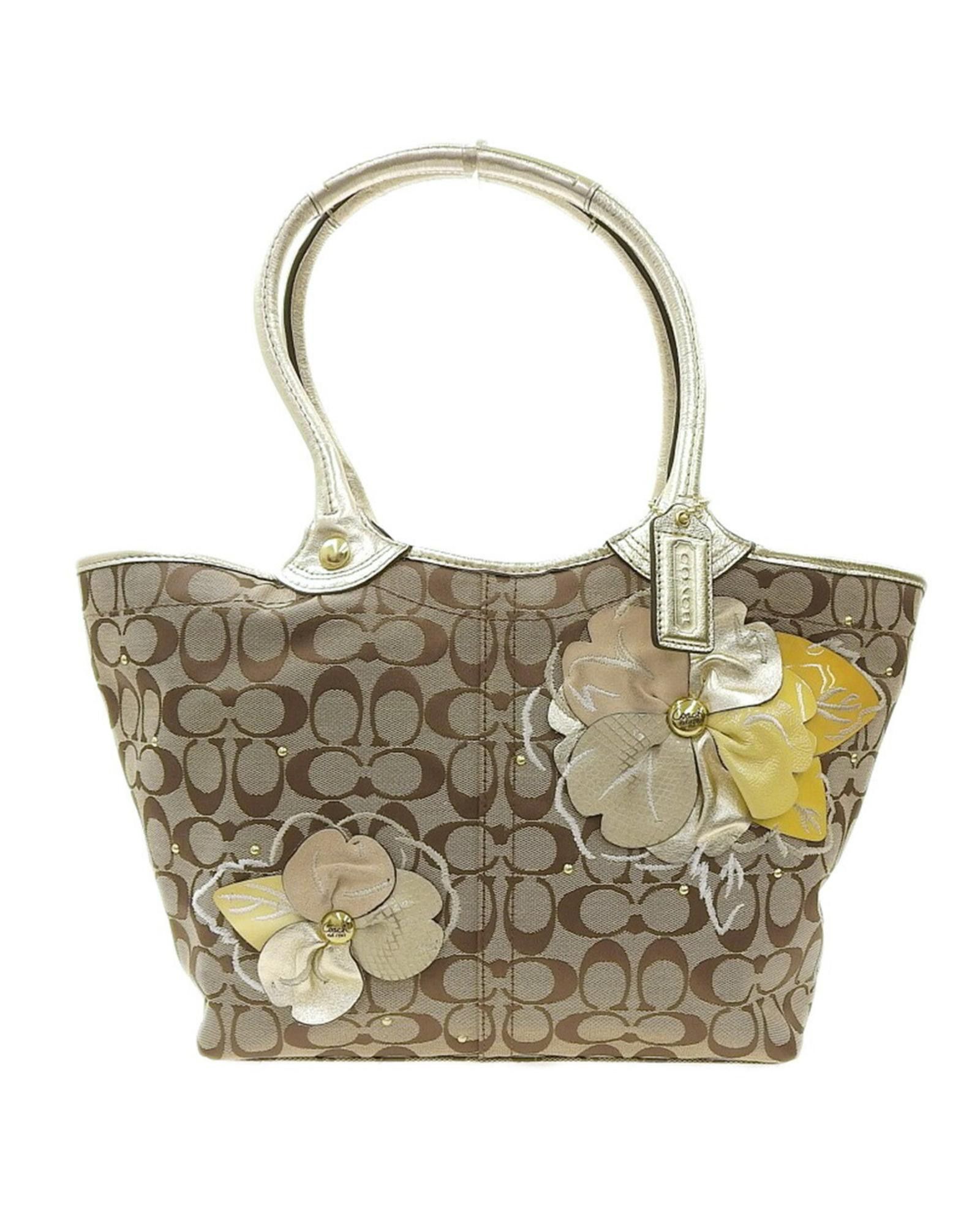 image of Coach Signature Canvas Charm Bag in Beige, Women's