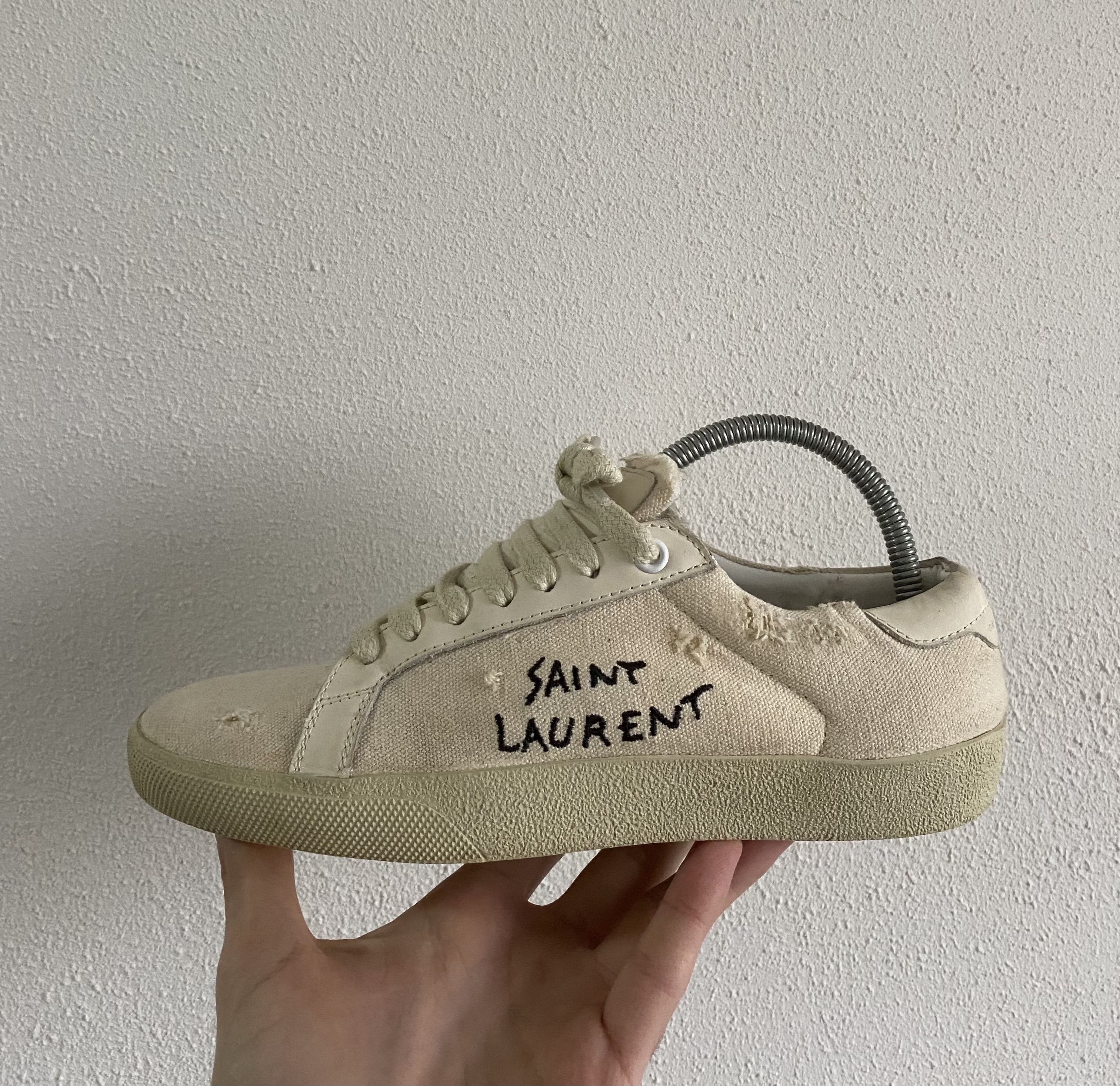 image of Saint Laurent Paris Saint Laurent Sl/06 Distressed Canvas Sneakers in Cream/White, Women's (Size 8)