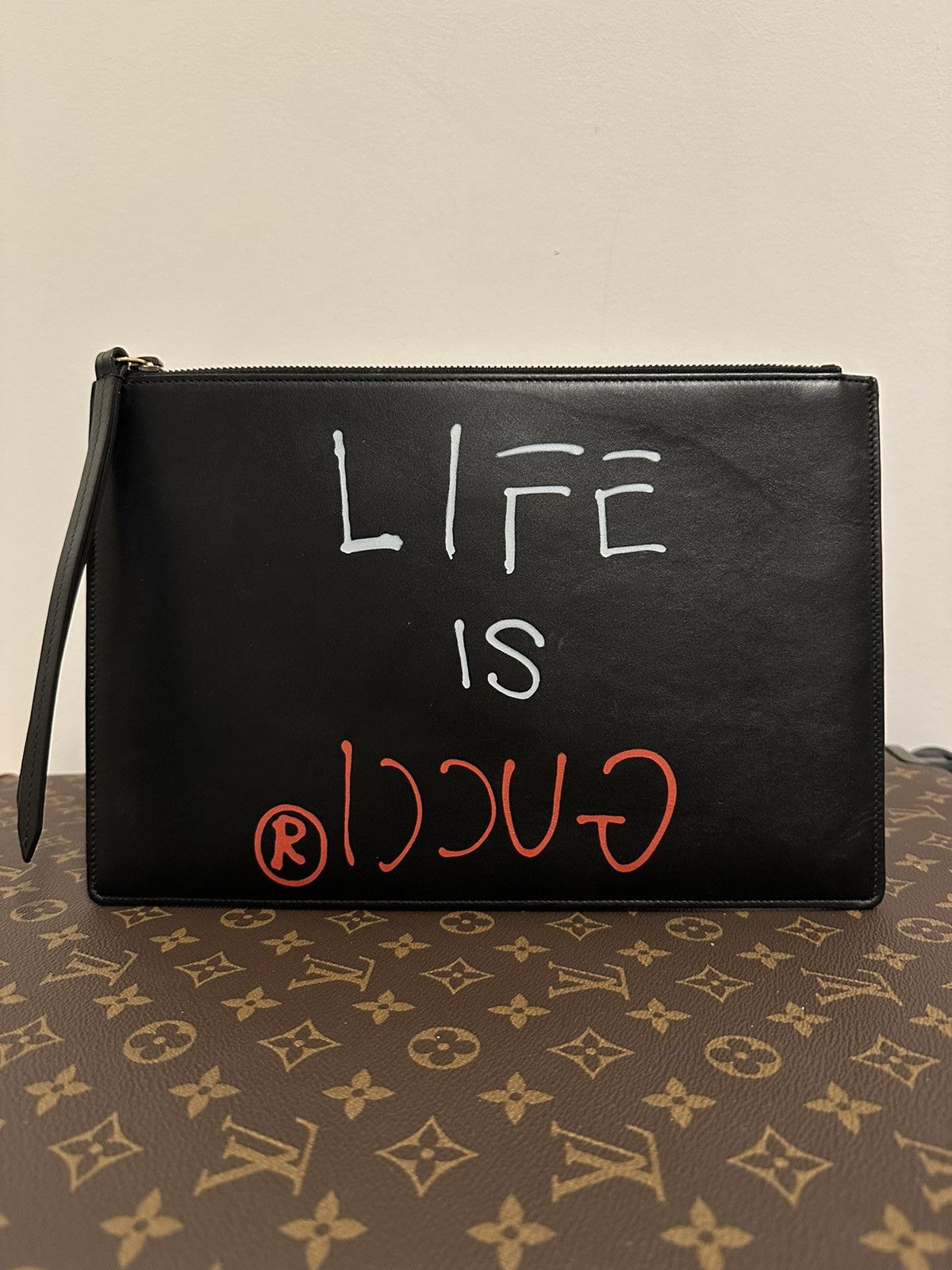 image of Gucci Life Is Gucci Leather Pouch in Black, Men's