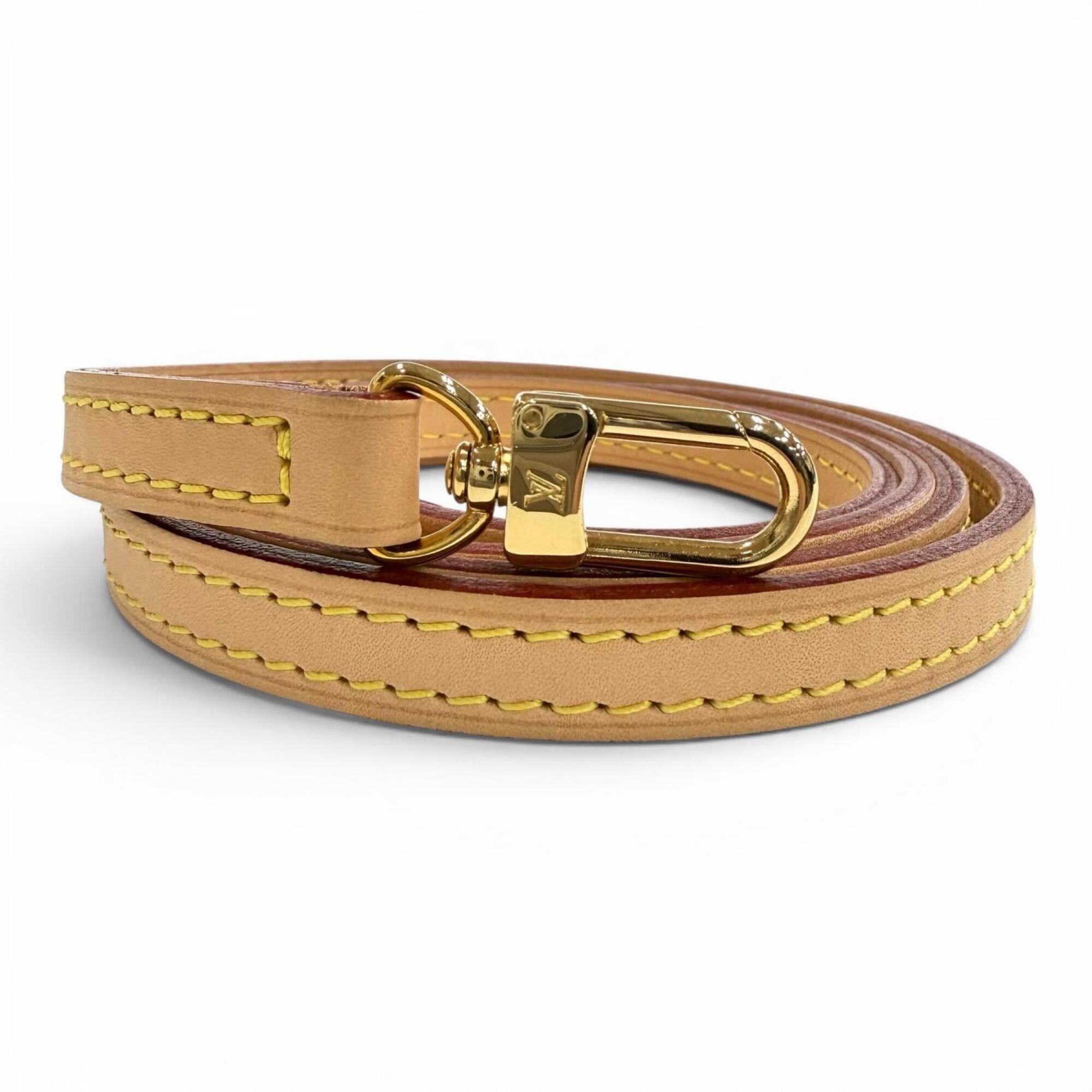 Louis Vuitton Louis Vuitton logo-embossed vachetta leather shoulder strap, light brown, gold hardware, made in France, women's. Size ONE SIZE - 1 Thumbnail