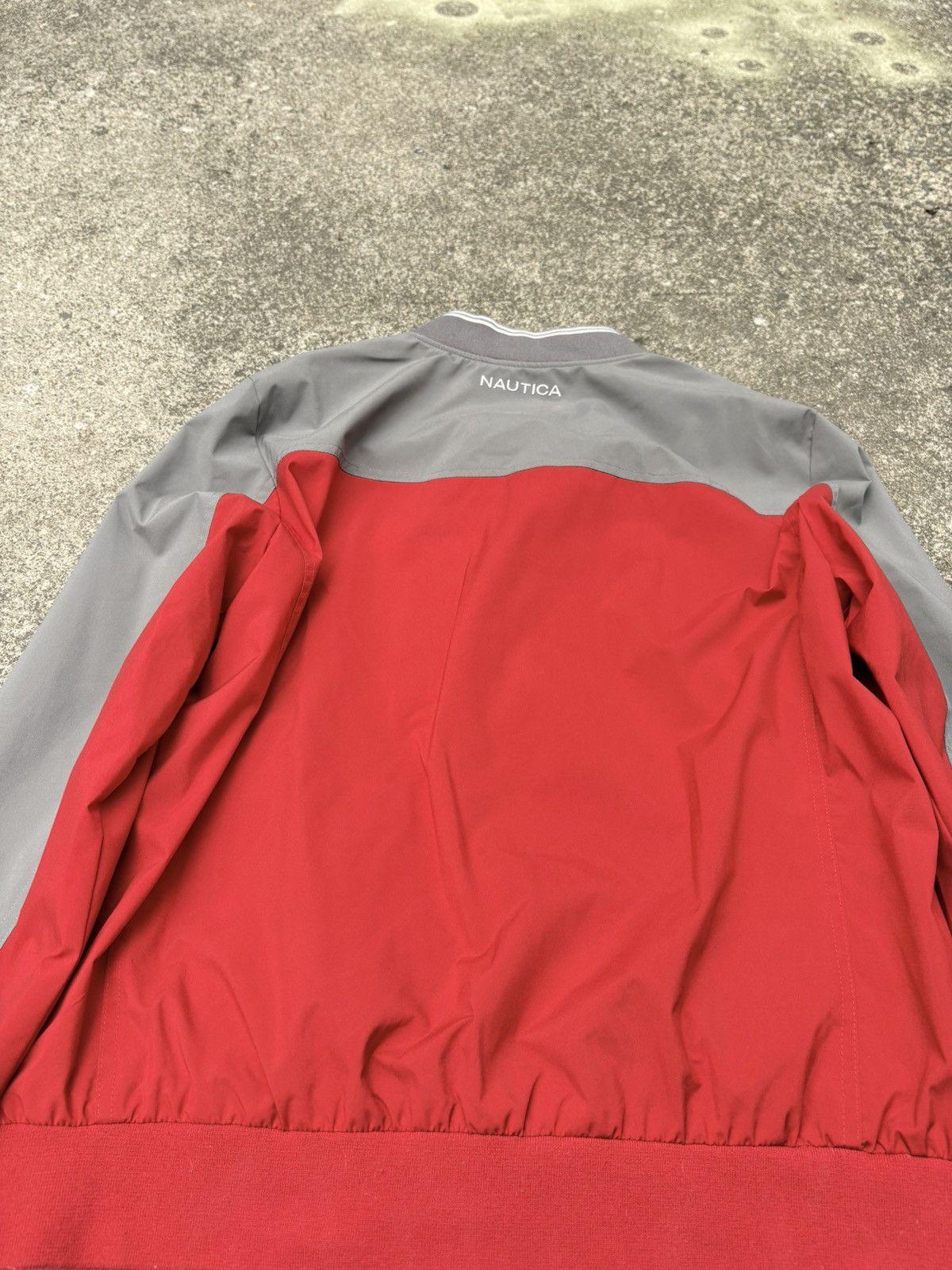 Nautica Nautica full-zip bomber in a red and grey colorblock build. Size US L / EU 52-54 / 3 - 7 Thumbnail