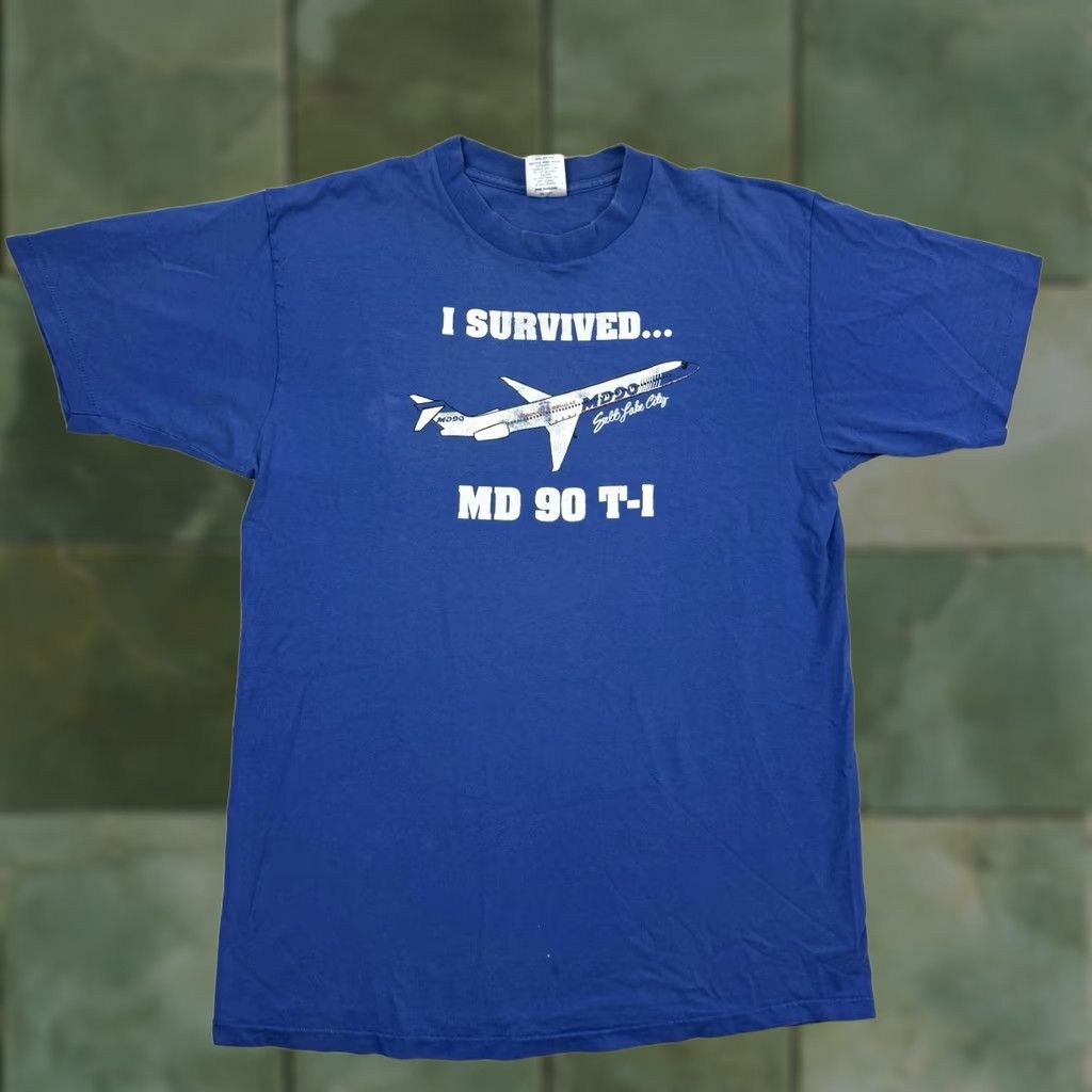 Delta VINTAGE Delta MD 90 T Shirt Adult XL I Survived MD 90 Salt Lake City Men T-Shirt Blue Cotton Short Sleeve Crew Neck 90s City Airplane Gir.. Size US XL / EU 56 / 4 - 1 Thumbnail