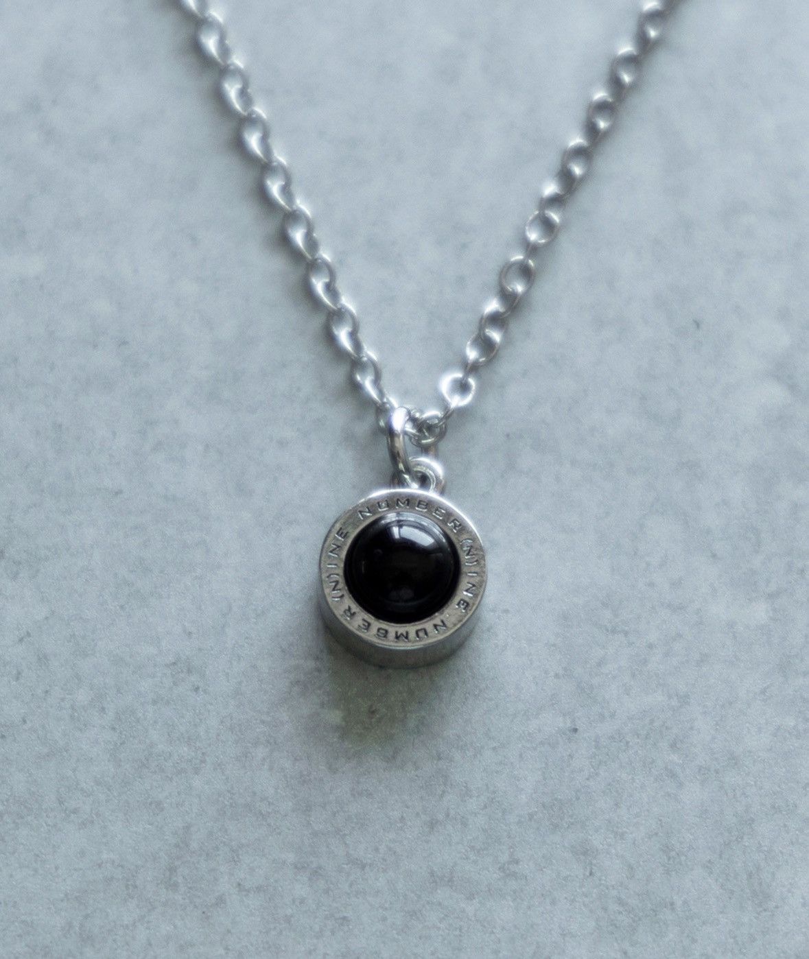 Number Nine ROUND LOGO STONE CHARM NECKLACE black