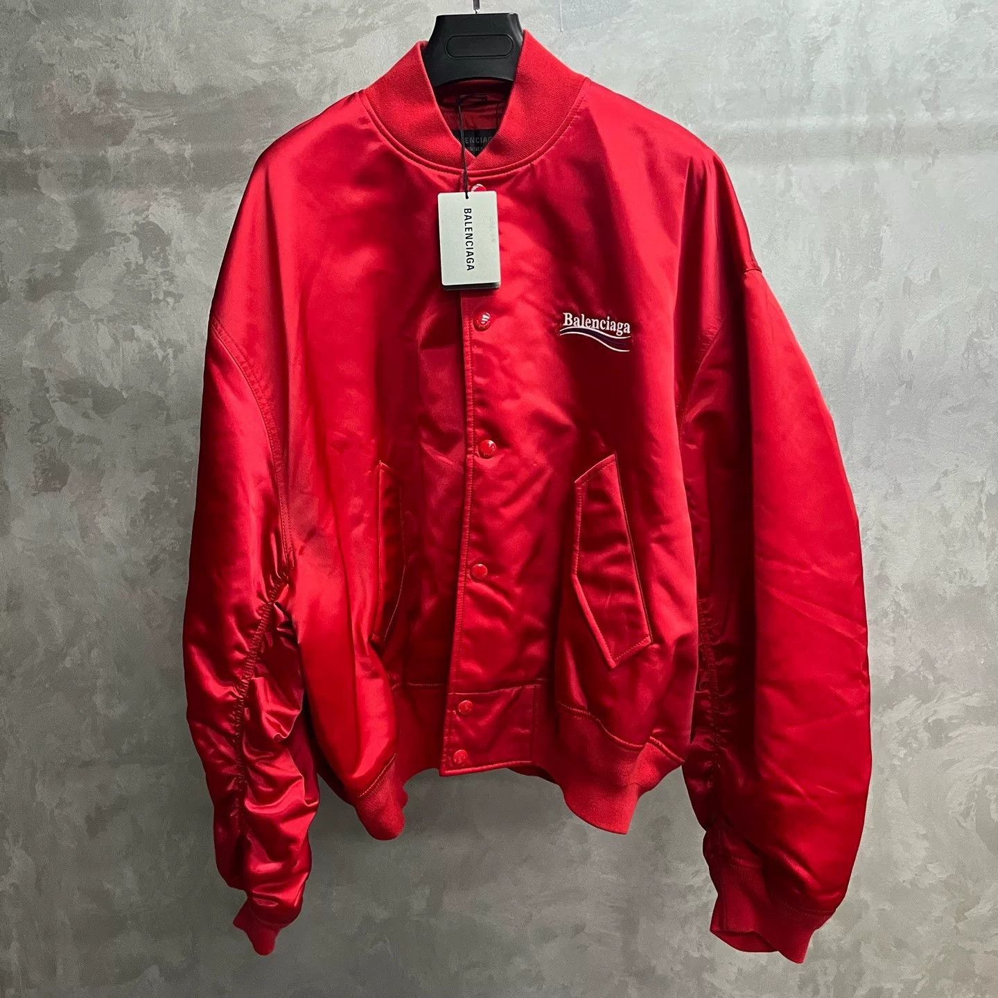 red logo print oversized jacket by balenciaga