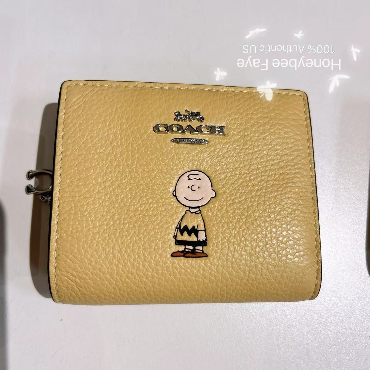 Coach Coach X Peanuts Snap Wallet With Charlie Brown CBN90 Size ONE SIZE - 1 Thumbnail