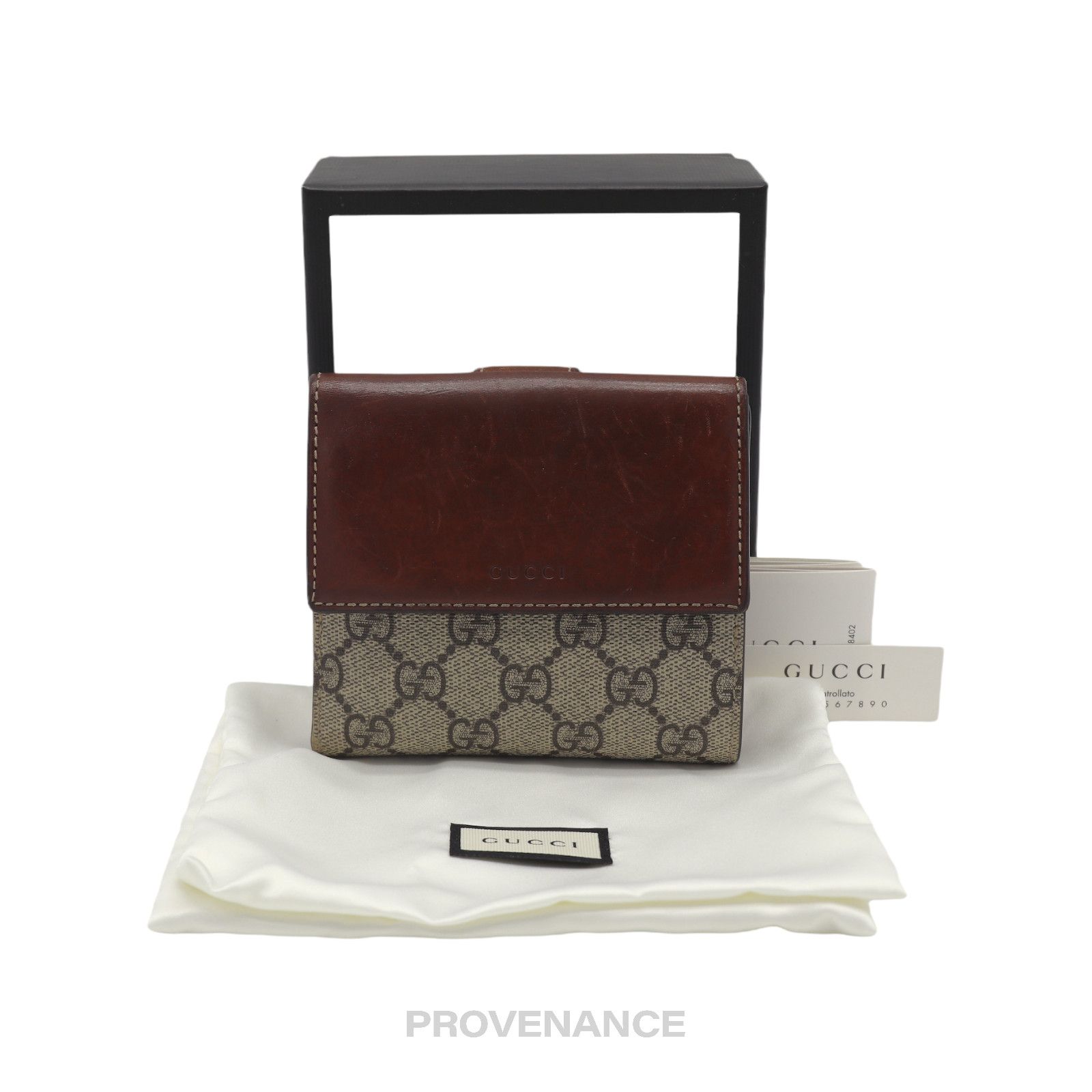 image of Gucci GG Supreme Trifold Wallet in Brown, Women's