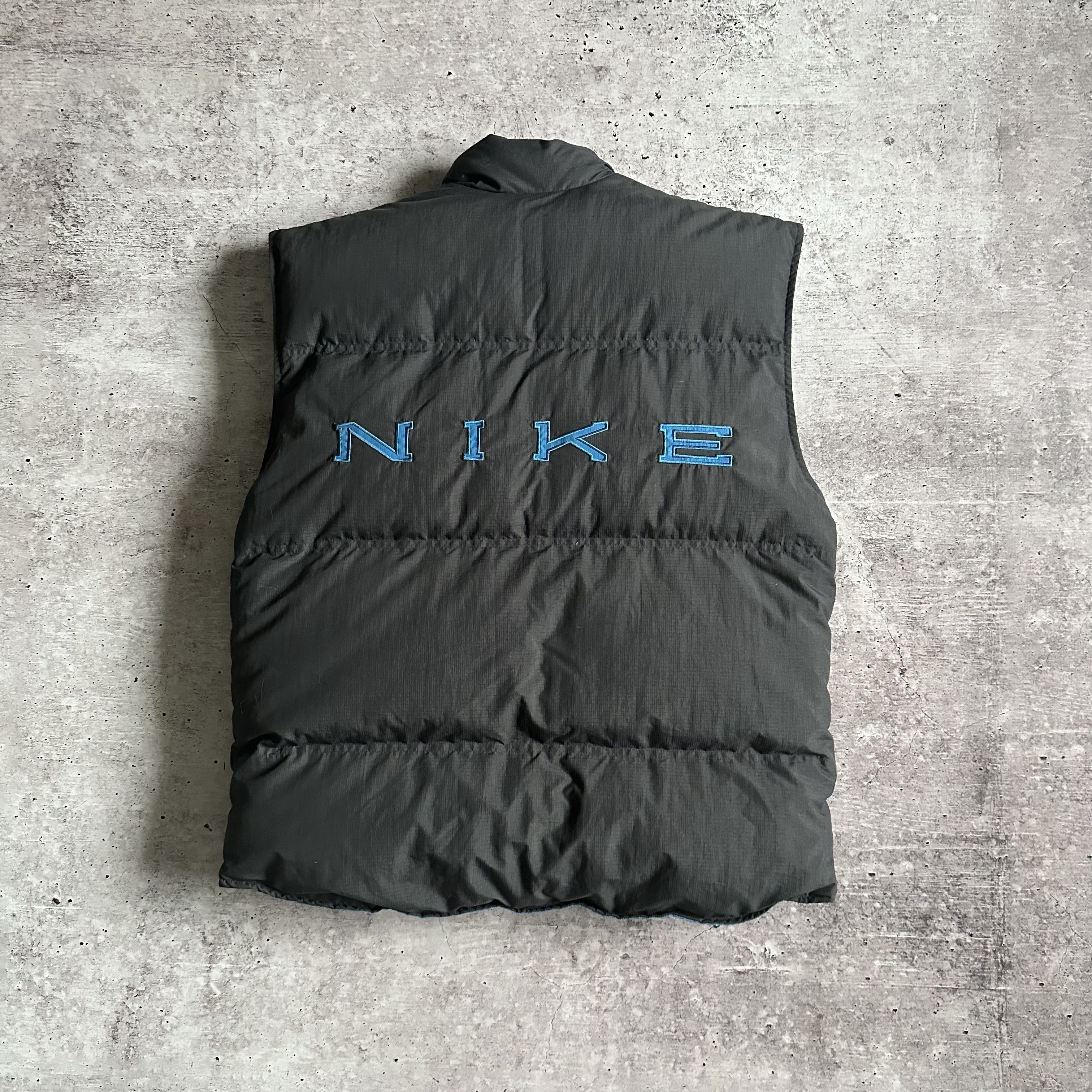 image of 90's Vintage Nike Reversible Spellout Puffer Down Vest in Asphalt Gray/Blue, Men's (Size Medium)
