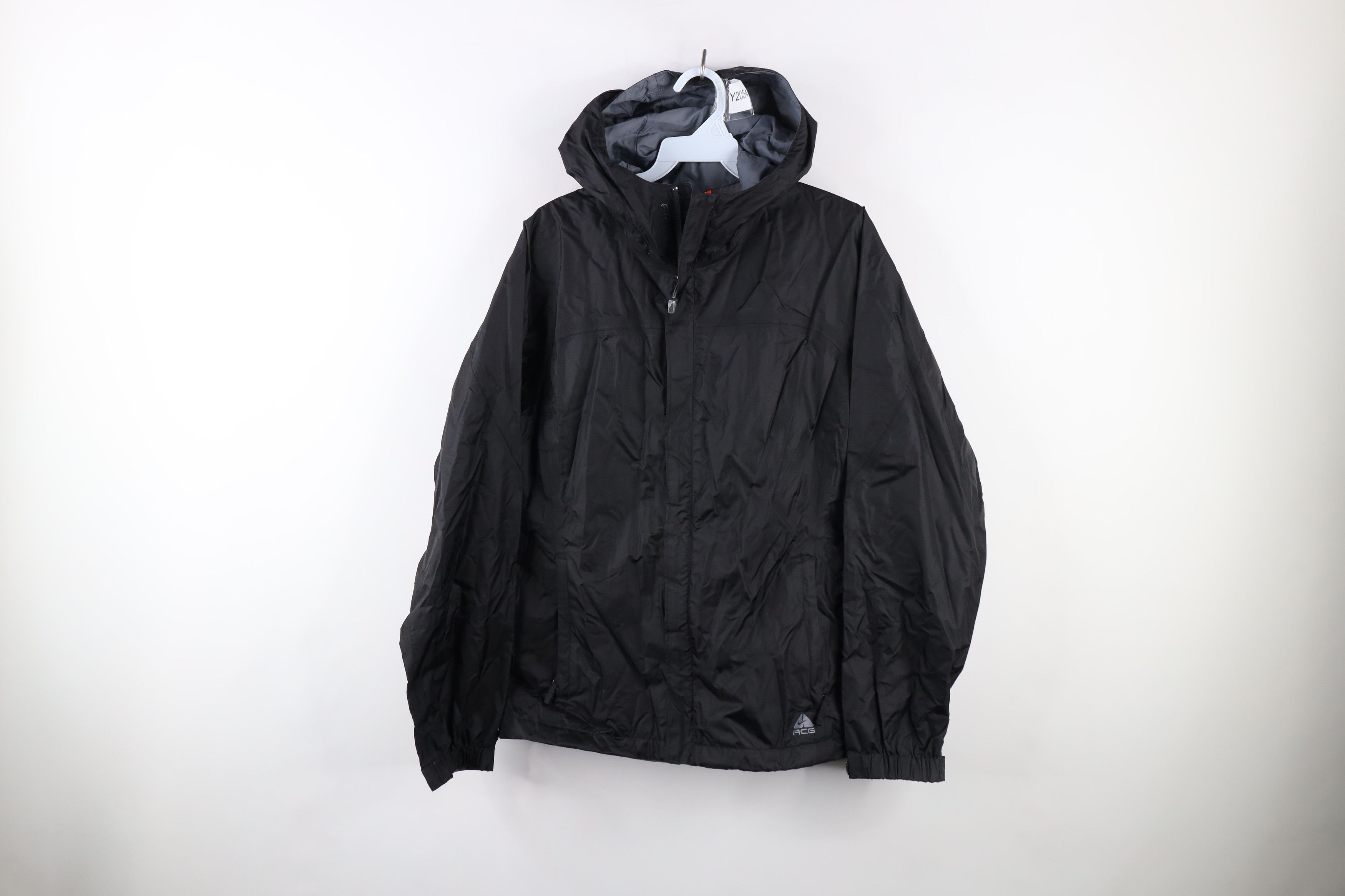 image of Nike Acg Storm Fit Mini Swoosh Hooded Rain Jacket in Black, Men's (Size Medium)