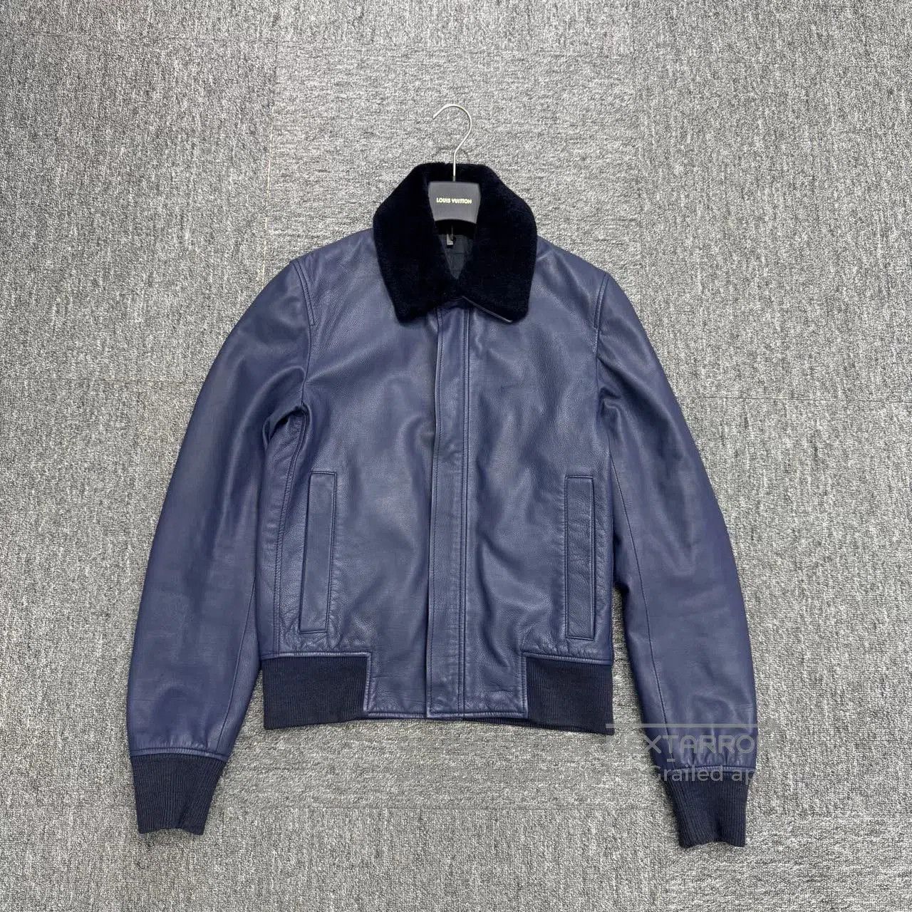 dior navy lambskin leather jacket with fur collar.