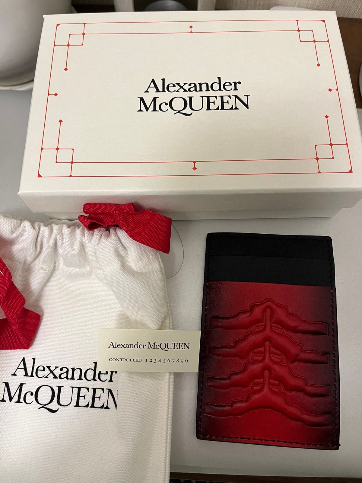 Pre-owned Alexander Mcqueen Bnwb  Embossed Rib Cage Card Holder In Red