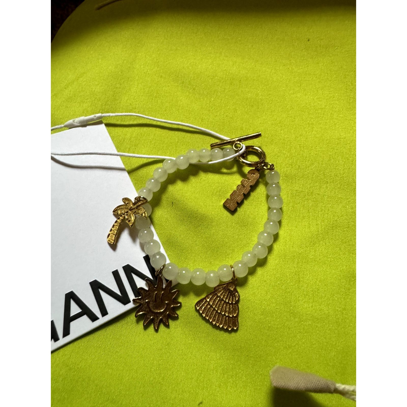 Ganni Ganni White beaded bracelet with gold charms Size ONE SIZE - 10 Thumbnail