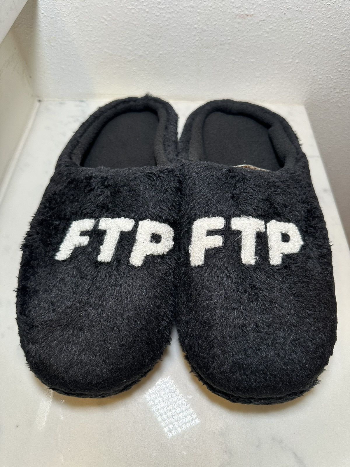 image of Fuck The Population Ftp Fleece Logo Slippers (11-12) in Black, Men's