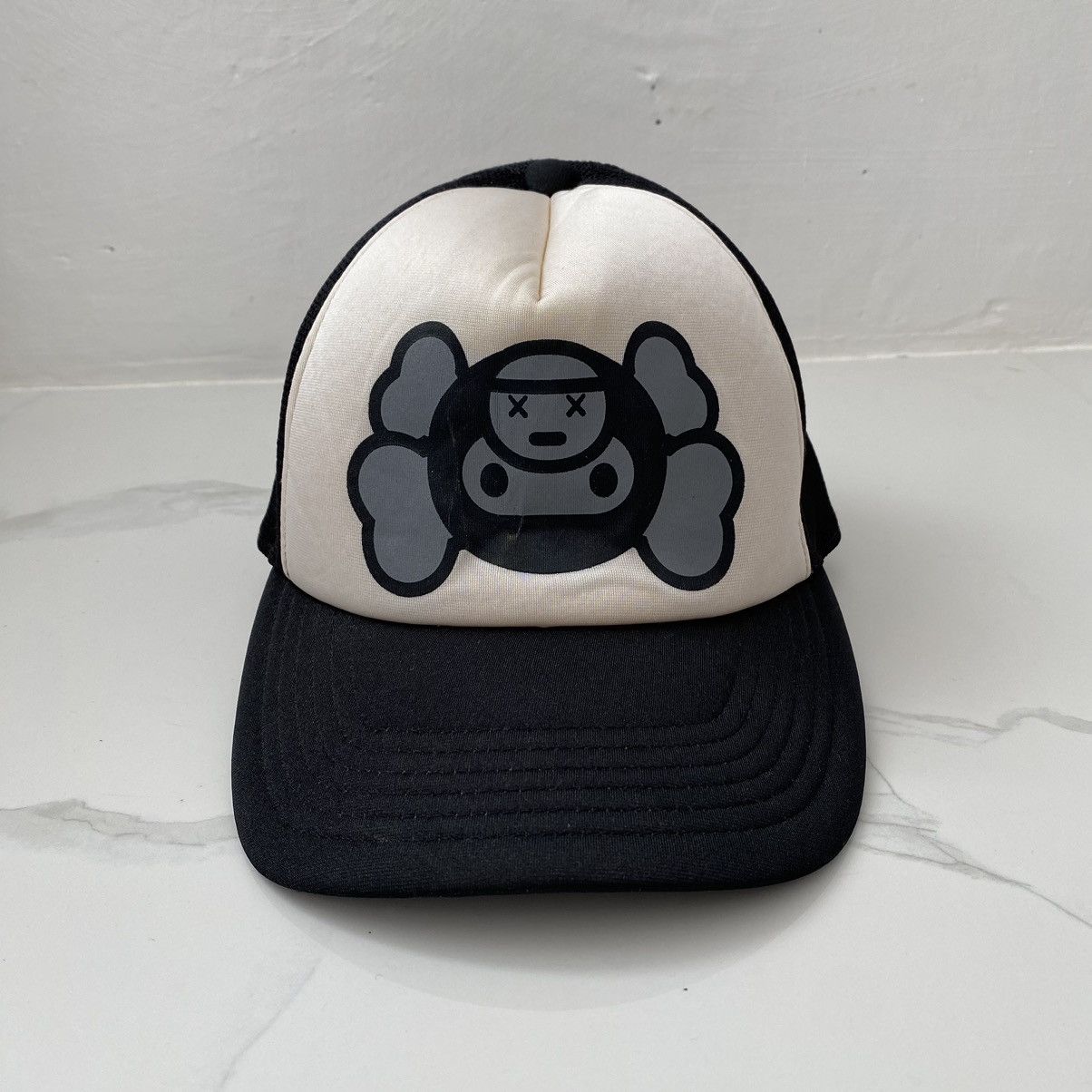 image of Bape x Kaws Baby Milo Mesh Cap in Black, Men's