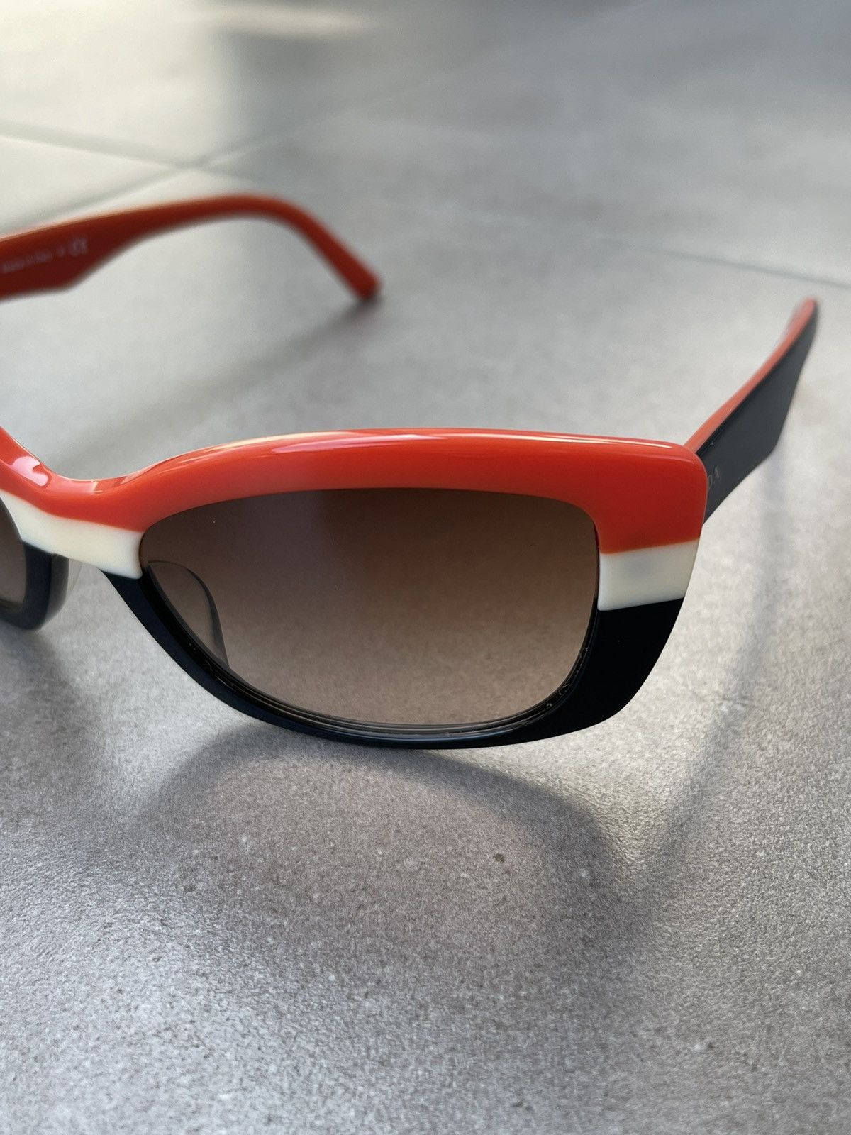 Prada Prada SPR 03N DAN-6S1 Black White Red Sunglasses Size ONE SIZE - 1 Thumbnail