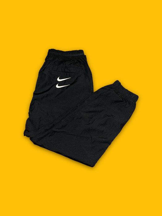 double swoosh track pants