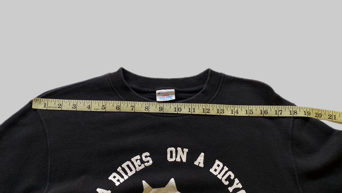 Champion × Ne-Net VTG Ne-Net x Champion “Nya Rides on a Bicycle” Size US L / EU 52-54 / 3 - 7 Thumbnail