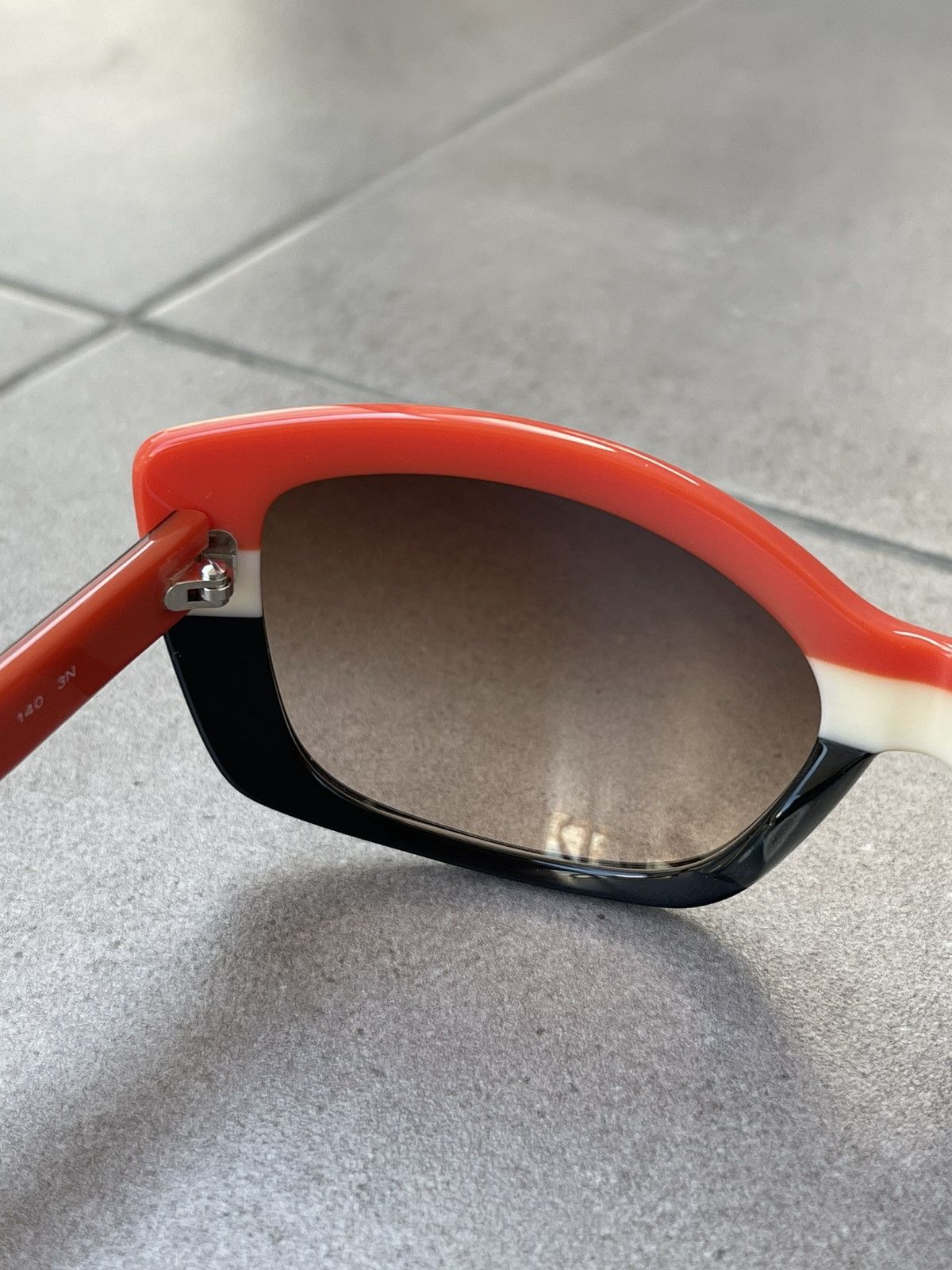 Prada Prada SPR 03N DAN-6S1 Black White Red Sunglasses Size ONE SIZE - 9 Thumbnail